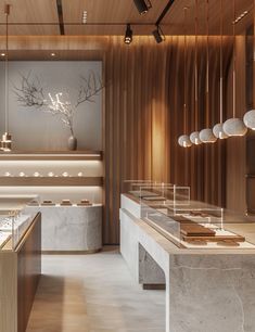 the interior of a jewelry store with marble counter tops and pendants hanging from the ceiling