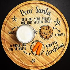 a wooden platter with cookies, milk and carrots on it that says dear santa