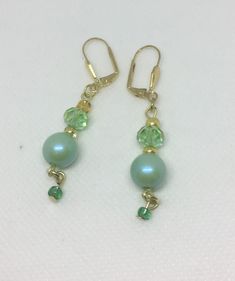 Dainty green bead dangle earrings in shades of green . Perfect as a gift or treat for yourself! Matching necklace also on this site. Nickel-free Green Earrings For Party, Green Nickel-free Party Earrings, Elegant Hypoallergenic Green Jewelry, Elegant Green Hypoallergenic Jewelry, Nickel-free Green Beaded Earrings For Parties, Green Pearl Drop Necklace Gift, Green Pearl Drop Necklace For Gift, Handmade Green Earrings For Party, Green Adjustable Jewelry With Matching Earrings