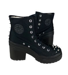 One pair of new without box unisex adult Converse Chuck 70 De Luxe Heel Hi Studded Boot (A08103C). The color is black, and the size is woemn's US 10 (fits men's US 8) (UK 8, EUR 41.5, CM 26.5). Specifications: High heel  Studded accents High top Canvas material upper Converse Chuck Taylor All Star logo on inner ankle and back heel  Shipping: We ship all items within 24 hours excluding weekends and federally recognized holidays. Returns: We accept domestic returns for this item within 30 days. New items returned in used condition will not be accepted. Questions? Feel free to message us. We will return your message promptly. Looking for more discounted brand names? Shop our store! Heels Converse, Chuck 70 De Luxe Heel, New Converse, Converse Chuck 70, Studded Boots, Star Logo, Chuck 70, Black Boots Women, Converse Chuck Taylor All Star