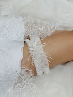 The elegant stretchy wedding garter in light ivory color with sewn manually pearl beads, lovely white ostrich feathers, sparkling seed beads and crystal dangles will add that extra special touch to your Special Day! The luxury modern thigh garter for bride is handmade with attention to details and will definitely add that special bohemian vibe to make the celebration memorable! 🤍The weight of the bridal garter is 0.033 lb (15 g) The elastic band's width is 2" (5 cm) 🤍Please, provide us with yo Thigh Garter, Bride Elegant, Leg Garters, Leg Garter, Wedding Garters, Light Ivory, Bridal Garter, Wedding Garter, Ivory Wedding