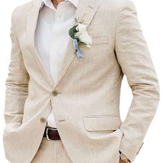 a man wearing a tan suit and white shirt with a flower in his lapel