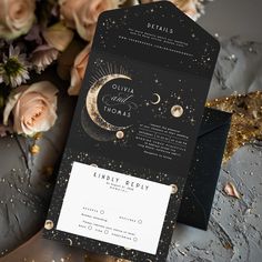 a black and gold wedding card with the moon on it