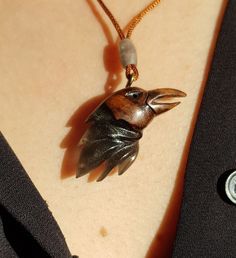 This is a 100% handmade Resin & Stabilized Wooden necklace. I'm proud to have this handmade necklace in my shop. This Raven Bird pendant will make a perfect unique gift for Christmas, i will send it in a nice giftbox. This necklace is made of Resin & Stabilized Wood and completely handcrafted. Every detail is carefully handcarved. Cord is adjustable Ready and packed for shipping, what you see is exactly what you get. Please contact me for custom order. Unique Personalized Round Pendant Necklaces, Traditional Handmade Collectible Necklaces, Nature-inspired Round Pendant Jewelry For Crafting, Traditional Handmade Collectible Necklace, Traditional Handmade Necklaces For Collectors, Artisan Jewelry With Lobster Clasp As Gift, Artisan Jewelry With Lobster Clasp For Gift, Brown Carved Round Pendant Necklace, Nature-inspired Pendant Jewelry For Crafting