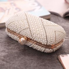 Item Type: Clutch Gender: Women Material: Polyester, Artificial Pearl, Metal Style: Fashion Closure Type: Hasp Size: 19 x 9.5 x 7 cm / 7.48 x 3.74 x 2.76 inch Package Includes: 1 x Pc Evening Fashion, Dress Bag, Pearl Dress, Classy Fashion, American Fashion, Back Women, Bag Dress, Pearl Color, Metal Style