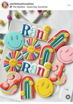 some cookies that are on top of a white plate with the words rad and rainbow