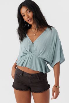 Radiate effortless style in this kimono-inspired woven top. It features a deep v-neckline with hook & eye closures, flowy fit and solid color wash. O'Neill Women's woven top Skimmer length Kimono style Peplum Waist Hook and eye closure Solid color wash 100% Viscose Crinkle Woman Weaving, Triangle Bralette, Kimono Style, Woven Top, Womens Clothing Sizes, Hook Eye, Kimono Fashion, Silver Blue, Effortless Style