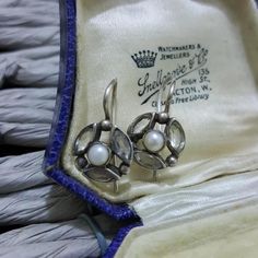 Stunning pair of sterling silver vintage earrings, they measure 2cm x 1.3cm, closed hooks, a fabulous Victorian inspired design with 3 marquise cut white topaz surrounding a delicate Mabe pearl Extremely elegant and feminine Hallmarked 925, in very good vintage  condition Weight 3.5gr All gemstones have been fully tested All silver has been fully verified Jewellery box is for presentation purposes only Art Deco Hallmarked Drop Earrings, Art Deco Round Pierced Earrings, Vintage Oval Earrings Hallmarked, Vintage Oval Hallmarked Earrings, Victorian Hallmarked Pearl Earrings As Gift, Antique Hallmarked White Gold Earrings, Antique White Gold Hallmarked Earrings, Antique Silver Marquise Jewelry, Vintage Hallmarked White Gold Earrings