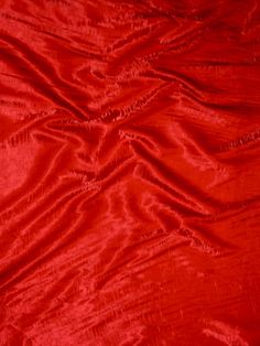 the red fabric is very soft and shiny