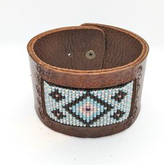 "Bracelet cuff from tooled genuine veg tan leather and handwoven from beautiful, filigree Japanese Miyuki delica glass beads. Measurements: 8.25 \" X 1.5 \" Fits wrist size from 6\" - 6.8\" Please let me know if you need smaller or larger size." Dragon Headband, Hand Tooled Brown Cuff Jewelry, Southwestern Hand Tooled Brown Cuff Bracelet, Southwestern Brown Leather Cuff Bracelet, Western Style Turquoise Bracelet, Hand Tooled, Western Brown Hand-tooled Leather Bracelet, Dragon Bracelet, Beautiful Dragon, Veg Tan Leather