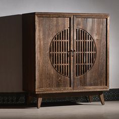 a wooden cabinet with two doors on one side and an open door on the other