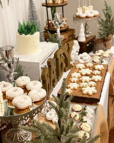 a table topped with lots of cakes and desserts