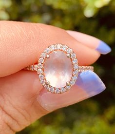 This gorgeous rose quartz ring is so elegant and delicate! definitely one of the favorites 😍 Natural Rose Quartz helps with love, self-love and inner healing <3 We all need a little bit of that, don't we? Main metal: 925 Sterling Silver (engraved)  14k Rose Gold plating  Main Stone: Natural Rose Quartz  - 10 mm (0.39 in) x 8 mm (0.31 in) Accent stones: 5A Cubic Zirconia sizes:6,7,8,9 ✔️Excellent quality ✔️hypoallergenic  ✔️free domestic shipping  ✔️free microfiber bag Processing time 1-2 busine Blush Anniversary Ring With Center Stone, Elegant Blush Rings For Anniversary, Elegant Blush Ring For Anniversary, Morganite Rings In Blush Color For Gift, Blush Gemstone Ring Jewelry, Blush Morganite Ring For Gift, Blush Morganite Rings For Gifts, Morganite Gemstone Jewelry For Proposal, Morganite Ring For Proposal