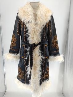 This is hand embroidered mongolian shearling trimmed black suzani coat.  What is materials ? - Natural mongolian shearling trimmed.  - interior lining is factory wool. İt keeps warm.  - Outside material is embroidery suzani talestry.  What is length ?  - 43 inches. 110 cm.  What is custom made ? - We can make similar coat, length as you want, diffirent fur colour, and custom sizes.  Where is it made ? - Made in Turkiye.  Do they run small or big ? - Please select your regular size. We just add b Traditional Winter Costume Outerwear, Traditional Black Outerwear For Costume, Traditional Black Costume Outerwear, Vintage Embroidered Outerwear For Costume, Vintage Embroidered Costume Outerwear, Mother Days, Embroidery Coat, Unique Boots, Bohemian Mode