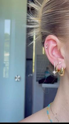 a close up of a person with ear piercings