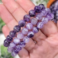 To stay updated with new items follow us on Instagram @LovingThyselfRocks OR Click the link below! https://www.instagram.com/lovingthyselfrocks/ ONE Chevron Amethyst Bracelet Intuitively selected. Bead Size: 8mm or 12mm Wrist size is 6 1/2 in, stretchy string. Chakras: Third and Crown Benefits of Amethyst: -Best crystal for meditation. -Encourages mind to be humble. -Increases understanding of intuition. -Encourages the mind to surrender to that which is greater than itself. -Develops direction Hand-strung Amethyst Stretch Bracelet, Adjustable Amethyst Round Bead Crystals, Purple Gemstone Beads Stretch Bracelet, Amethyst Beaded Bracelets For Healing, Purple Spiritual Stretch Bracelet, Purple Gemstone Stretch Bracelet With Round Beads, Purple Stretch Bracelet With Natural Stones, Purple Natural Stones Stretch Bracelet, Purple Round Bead Gemstones For Gifts