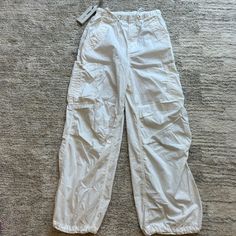 Aritzia Tna White Parashute Pants - New With Tags! Size Xs (Typically Size 23-24.5) Good For Summer, Vacation, Outdoors, Festival! White Straight Leg Cargo Pants With Elastic Waistband, White Straight Pants With Cargo Pockets, White Cargo Pocket Trousers, White High-waisted Cargo Pants, White Cargo Bottoms For Spring, White Cargo Bottoms, White Parachute Pants With Elastic Waistband, White Wide-leg Cargo Pants With Elastic Waistband, White Straight Parachute Pants With Elastic Waistband