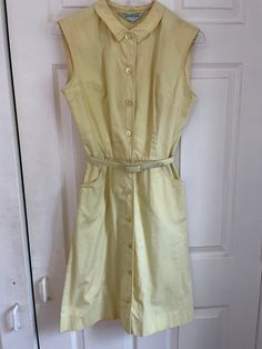 Adorable vintage 50s/60s button down summer dress.  Despite being in not great condition (several marks pictured), it's still so cute! Could probably improved with the right care/products. Sold as is. Measurements taken flat: Waist: 13" Pit to pit: 17" Waist to hem: 20" Top of neck to waist: 16" Shoulder to shoulder: 15" Vintage A-line Dress With Buttons, Classic A-line Vintage Dress With Button Closure, 1950s A-line Dress With Buttons, Spring 1950s Style Knee-length Vintage Dress, Retro Spring Button-up Dress, Retro Button-up Spring Dress, Retro Collared Dress With Button Closure, 1950s Vintage Dress For Summer, 1950s Style Vintage Dress For Summer