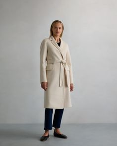 Elevate your winter wardrobe with this 100% Mongolian Cashmere Double-Faced Wrap Coat. Made from Mongolian cashmere known for its crazy-soft feel and toasty warmth, this coat features flap pockets and a notched lapel. A removable tie belt lets you cinch the waist for the perfect fit.  | Quince | Women's 100% Mongolian Cashmere Double-Faced Wrap Coat in Ivory Coast, Size Medium Cashmere Wrap, Inner Mongolia, Wrap Coat, Ivory Coast, Tie Belt, Quince, Winter Wardrobe, Flap Pocket, Cashmere