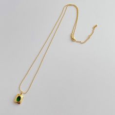 Add a touch of elegance to any outfit with our Emerald Necklace. Featuring a brilliant green CZ stone and multiple layers of 14k gold plating, this 18" necklace is both waterproof and anti-tarnish for everyday wear. Perfect for any occasion. Green Tarnish-resistant Pendant Necklace, Everyday Green Gold Plated Jewelry, Everyday Green Gold-plated Jewelry, Green Gold-plated Everyday Jewelry, Green Emerald Gold-plated Pendant Necklace, Green Gold-plated Emerald Pendant Necklace, Green Gold Plated Necklace With Adjustable Chain, Tarnish Resistant Gold Plated Green Necklaces, Tarnish Resistant Green Gold Plated Necklaces