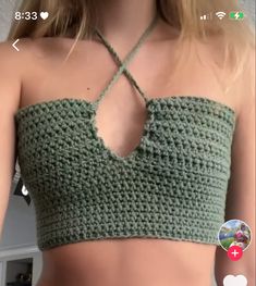 a woman wearing a green crochet crop top