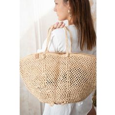 Embrace the essence of summer with our exquisitely crafted Sinah beach bag, a spacious and beautifully designed accessory perfect for both city strolls and sunny beach days. Handmade with love and care by talented women artisans in Madagascar, this intricately weaved bag showcases their traditional craftsmanship, making each piece unique and special.  By choosing the "Madagascar Summer Breeze" beach bag, you support the livelihoods of women artisans in Madagascar, empowering them to continue the Summer Woven Sand-colored Shoulder Bag, Beachy Sand-colored Beach Bag With Braided Handles, Sand-colored Shoulder Bag For Summer Travel, Summer Style Sand-colored Shoulder Bag, Spring Beach Sand-colored Straw Bag, Chic Summer Bags Made Of Natural Fiber, Sand-colored Straw Bag For Summer Beach, Chic Beach Bag Made Of Natural Fiber, Beachy Sand-colored Straw Bag