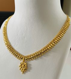 Indian designer choker necklace , 916 Yellow Gold GOLD PURITY : pure 22k / 916 gold purity Appx Weight: 14.30 - 14.60grams Length  :  adjustable upto 18 inches Length  Colour : YELLOW GOLD Hallmark: Hallmarked 916 stamp Hook: '' fish hook Design  :Beautiful choker necklace indian style pendant bombay necklace set.  ( Pendant is attached to the chain ) Design will be similar to listings designs pictures depending on stocks availability.  Authentic 916 Gold FAQs Q: Is it real gold? A: yes it's rea Necleses Jewelry Gold Indian Latest, 30 Grams Gold Necklace Indian, Choker Necklace Indian, Indian Gold Necklace Designs, Simple Necklace Designs, Indian Choker Necklace, Neck Pieces Jewelry, New Gold Jewellery Designs, Fancy Jewelry Necklace