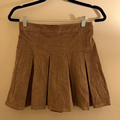 Nwt Pleated Skirt Brown Flowy Lined Mini Skirt, Flowy Brown Lined Mini Skirt, Brown Pleated Tennis Skirt, Brown Mini Pleated Lined Skirt, Brown Lined Mini Pleated Skirt, Brown Mini Skort, Brown Lined Tennis Skirt For Spring, Tan Pleated Skirt, Midi Flowy Skirt