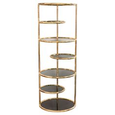 three tiered gold metal shelf with glass shelves