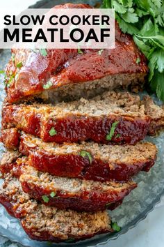 sliced meatloaf with sauce and parsley on the side, ready to be eaten