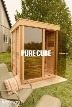 an outdoor sauna with the words pure cube written on it