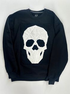 Are you ready for spooky season? Add this to your fall wardrobe! Please make requests for specific changes in color or size.  Skull pattern by SkullsandneedlesMerx Black Crew Neck Sweatshirt With Skull Print, Winter Skull Print Cotton Tops, Winter Cotton Tops With Skull Print, Black Long Sleeve Sweater With Skull Print, Winter Cotton Top With Skull Print, Halloween Skull Sweatshirt In Black, Black Skull Sweatshirt For Halloween, Black Halloween Sweatshirt With Skull, Edgy Skull Print Sweatshirt For Winter