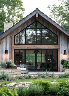 a house that is made out of wood and glass