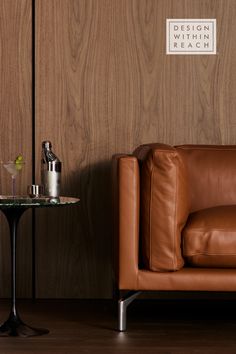 leather sofa with side table with glass on top