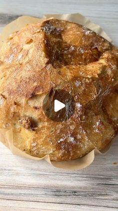 a loaf of bread sitting on top of a wooden table