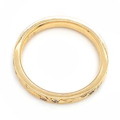 Enter a realm of beauty with this unique band! Crafted to enchant, this magical piece features intricately engraved swirls dancing across radiant yellow gold, accentuated by sparkling diamonds. Perfect for adding a touch of fairy-tale charm to any hand or for enhancing your engagement ring. Cold Hard Facts: metal: 14K yellow gold gem: (12) round white diamonds - 0.12ctw shank width: approx. 3mm finger size: 6 Elegant Etched Yellow Gold Jewelry, Ornate Yellow Gold Jewelry With Decorative Band, Ceremonial Yellow Gold Jewelry With Single Cut Diamonds, Ceremonial Gold Diamond Ring, Yellow Gold Diamond Jewelry With Decorative Band, Heirloom Gold Engraved Ring With Rose Cut Diamonds, Elegant Gold Diamond Ring For Ceremonial Occasions, Ceremonial Yellow Gold Jewelry With Diamond Accents, Formal Gold Engraved Ring With Single Cut Diamonds