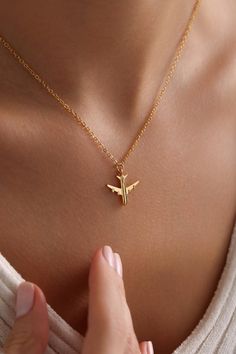 Welcome to the Magical World of PKJewelry Tiny Airplane Pendant Necklace Gold Plated Minimalist Airplane Pendants Necklace is perfect as a special gift for her. This travel necklace is a great choice as a gift for Mother's Day, Birthday, Anniversary, Valentines Day, Christmas. Our high quality products are specially prepared for you with great care. The gold plating on it is much thicker than other platings. Therefore, it is a nice gift to be used for a long time. Our products do not tarnish and are anti-allergic. - Our chains are sent with 16 inch and 2 inch extension chain. You can adjust it to the size you want. If you want it shorter or longer, please contact us.  All Our Travel Necklace  https://www.etsy.com/shop/PKJewelryNecklace?ref=shop-header-name&listing_id=1794870106&from_page=l Airplane Pendant, Plane Necklace, Travel Necklace, Special Gifts For Her, Travel Lover, Gold Pendant Necklace, Elegant Jewelry, Birthday Anniversary, Mother Day Gifts