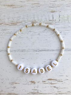 🔹This is a delicate bracelet customized with a name/word/saying of your choosing. It is made with white or black Japanese Miyuki glass seed beads and white acrylic beads with gold letters and then strung together with a strong elastic cord. It is beautiful to wear alone or to layer with other jewelry and is the perfect for yourself or for a gift. 🔹Each item is packed in a beautiful organza bag and a handwritten message can also be included. It makes the perfect gift for a baby shower, new mom, Personalized Adjustable Inspirational Charm Bracelet, Inspirational Adjustable Personalized Charm Bracelet, Personalized Inspirational Adjustable Charm Bracelet, Inspirational Personalized Adjustable Charm Bracelet, Minimalist Adjustable White Charm Bracelet, Personalized White Charm Bracelet For Birthday, Customized White Charm Bracelet For Gift, Customized White Bracelets As Gift, Customized White Charm Bracelet Gift