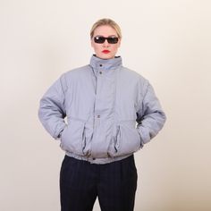 "Vintage Minimalist Oversized cropped bomber jacket with stowable hood in collar - Oversized 80s windbreaker in light gray - Lightweight, with lining. - Elasticated bottom - 35% cotton, 65% polyester - Excellent condition - Estimated size M. Please see exact measurements! Measurements: (taken flat and unstretched) Length: 26\" / 66 cm Shoulders: 22'' / 56 cm Bust (pit to pit): 24'' / 62 cm Bottom: 16'' / 41 cm unstretched, 22'' / 56 cm max stretch My tops are usually S/M, bottoms M/L. My height - 5'7'' / 170cm. 🧥 More vintage jackets in my shop: https://www.etsy.com/shop/GoodGrooves?ref=simple-shop-header-name&listing_id=1302016025&section_id=39130478 Please use the item measurements to know if the item will fit you. You can compare an item's measurements with the measurements of a simila 80s Windbreaker, Vintage Jackets, 1980s Vintage, Vintage Jacket, True Vintage, Light Gray, Suede Leather, Bomber Jacket, Leather Jacket