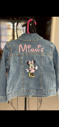 Denim jacket embriordered with pink Minnie Mouse.  Not all jackets are the same blue. If you would like to see the jacket before it's made, feel free to message me. Personalized Minnie Mouse Jean Jacket Pink, Cute Pink Denim Jacket With Pockets, Cute Pink Denim Jacket With Long Sleeves, Cute Pink Long Sleeve Denim Jacket, Casual Blue Denim Jacket With Custom Embroidery, Cute Fitted Denim Jacket With Pockets, Cute Fitted Long Sleeve Denim Jacket, Fitted Long Sleeve Cute Denim Jacket, Cute Denim Blue Cotton Outerwear