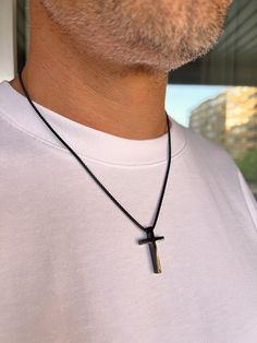 Men's Cross Pendant Necklace is a durable silver-colored box chain made of hypoallergenic stainless steel. A great choice as a gift for him. Dimensions: Cross - height 30 mm, width 18 mm, thickness 4.8 mm; Chain - thickness 2 mm, length of your choice. To choose the length of the necklace: 1. Prepare a thread and a ruler. 2. Take a thread of the desired necklace length. 3. Try it on in front of a mirror to see how it will look on your neck. 4. Unwind the thread and measure its length with a ruler. Following these steps, you can accurately determine a comfortable and stylish necklace length. Features: - Material: hypoallergenic stainless steel. - Design: classic rope chain. - Durability: Resistant to tarnishing, corrosion, and daily wear. - Comfort: Suitable for sensitive skin due to hypoal Durable Black Stainless Steel Jewelry, Minimalist Matte Black Jewelry For Gifts, Minimalist Matte Black Jewelry Gift, Modern Matte Black Jewelry For Gifts, Modern Matte Black Jewelry As Gift, Modern Matte Black Jewelry As A Gift, Minimalist Black Jewelry For Father's Day, Everyday Black Stainless Steel Necklace, Minimalist Black Cross Pendant Jewelry