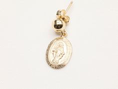 14k Gold Filled Virgin Mary Earrings / Miraculous Earrings / Catholic Jewelry / Gold Coin Jewelry / Catholic Gifts - 9 x 13mm Gold Filled Virgin Mary Pendant - Front design: Mama Mary - Back design: letter M with a cross on top and scattered stars - 14k Gold Filled 5mm stud - Sold as a pair - Tarnish free, hypoallergenic, nickel free and safe for sensitive skin 💰 We guaranteed fair pricing on all our jewelry. 🍃 All our jewelry comes with a modern style packaging, which includes a classy suede Gold Drop Earrings With Charms, 14k Gold Filled Charms Drop Earrings, 14k Gold Filled Drop Earrings With Charms, Yellow Gold Charm Earrings For Gift, Yellow Gold 14k Charm Earrings, 14k Yellow Gold Earrings With Charms, 14k Gold Pendant Earrings As A Gift, 14k Gold-filled Oval Earrings, Gold Earrings With Charms As A Gift