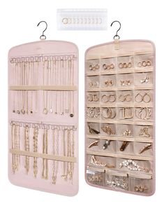 a pink jewelry case with two rows of necklaces and earrings hanging from it's sides