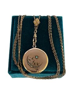 Stunning antique circa 1880's Celestial Motif Locket that hangs from a 1910s Edwardian era gold filled lorgnette chain! This gold filled cable style chain has a doubled chain style, and has a unique shaped charm that slides freely along the chain. The charm has a delicate engraved design with one genuine  seed pearls. A fantastic and versatile piece of Victorian & Edwardian era jewelry! ERA - Circa 1880s-1910's  METAL / MATERIAL - Gold filled chain, genuine opal, seed pearls  MARKINGS / HISTORY - The swivel clip is marked "RFG & CO", Locket marked D & C CONDITION - Good antique condition. Gold filled metal has been polished and cleaned. Age appropriate patina & wear remains. All stones are intact and secure. Amazing antique lorgnette chain and locket!  SIZE / MEASUREMENTS - Locket: 1 5/8 x Heirloom Filigree Necklaces For Ceremonial Occasion, Heirloom Filigree Ceremonial Necklaces, Ceremonial Heirloom Filigree Necklaces, Ceremonial Heirloom Filigree Necklace, Collectible Yellow Gold Necklace With Antique Finish, Heirloom Necklace With Intricate Design For Ceremonial Use, Victorian Round Necklace With Intricate Design, Victorian Necklace With Intricate Design, Victorian Necklaces With Intricate Design