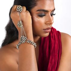 Jigyasa Hath Phool is a mesmerizing symbol of grace and allure. Crafted with utmost precision and adorned with cascading Ghungroo's and gleaming silver oxidized accents, it stands as a regal masterpiece that demands attention. As you slide this exquisite piece onto your hand, its delicate finger lets embrace you with comfort, while the sparkling gemstones and intricate petals add a touch of ethereal charm. Get one for yourself or gift it to your girl, Jigyasa is sure to adorn your attire. #Styli Adjustable Silver Beads Fusion Jewelry, Adjustable Fusion Style Silver Beaded Jewelry, Bohemian Bracelets For Navratri, Bohemian Bracelets For Navratri Festival, Silver Fusion Style Bracelets For Festival, Fusion Style Bracelets For Rituals And Festivals, Silver Fusion Bracelets For Festivals, Fusion Style Silver Bracelets For Festival, Festival Silver Beads Bangle Jewelry