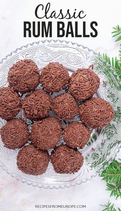 chocolate rum balls on a glass plate with pine branches in the background and text overlay that reads classic rum balls