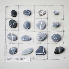 rocks with lines written on them are arranged in a grid