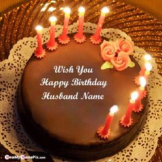 a birthday cake with lit candles on it sitting on a lace doily next to a card that says, thinking if you and the good times we spent make me smile