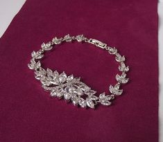 This luxurious bridal bracelet is made of clear AAA-quality cubic zirconia in beautiful marquise cut shape set in luster rhodium plated settings. The bracelet has lots of sparkle and shine and will be a perfect addition for your special day!  *The bracelet measures 7.2 inches / 18 cm long and closes with rhodium fold over clasp. This bracelet length fits best 6 inches wrists. If your wrist is bigger than 6 inches, your bracelet will be made with 1.5 inches extension chain for an extra length and Bracelet For Bride, Silver Wedding Bracelet, Bride Bracelet, Cz Bracelet, Swarovski Bracelet, Bracelet Crystal, Bridal Bracelet, Crystal Bracelet, Marquise Cut