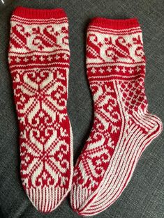 Handknit socks made with 100% wool with a beautiful traditional pattern. Perfect for Christmas! Nordic Knitted Winter Socks, Winter Nordic Knitted Socks, Scandinavian Style Winter Socks With Fair Isle Pattern, Nordic Style Winter Socks For Gift, White Knitted Winter Socks, White Knitted Socks For Winter, Hand Knitted Nordic Style Winter Socks, Nordic Style Hand Knitted Winter Socks, Knitted Socks For Winter Gifts